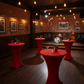 band recital in restaurant setup with Spandex Cocktail Table Cover 30" Round - Red