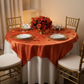 Square 72" Satin Table Overlay - Burnt Orange with gold trimmed charger plate | white dinner plate | wine goblets | white chiavari chair | white tablecloth 