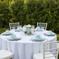 Taffeta Napkin 20"x20" - Baby Blue
 on top of white dinner | silver charger plate | wine goblets | white tablecloth | white chiavari chair