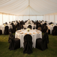 Taffeta-Universal-Self-Tie-Chair-Cover-Black on a marquee tent reception