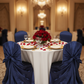 Universal Satin Self Tie Chair Cover - Navy Blue with ivory tablecloth | gold charger plate | white dinner plate | wine goblets