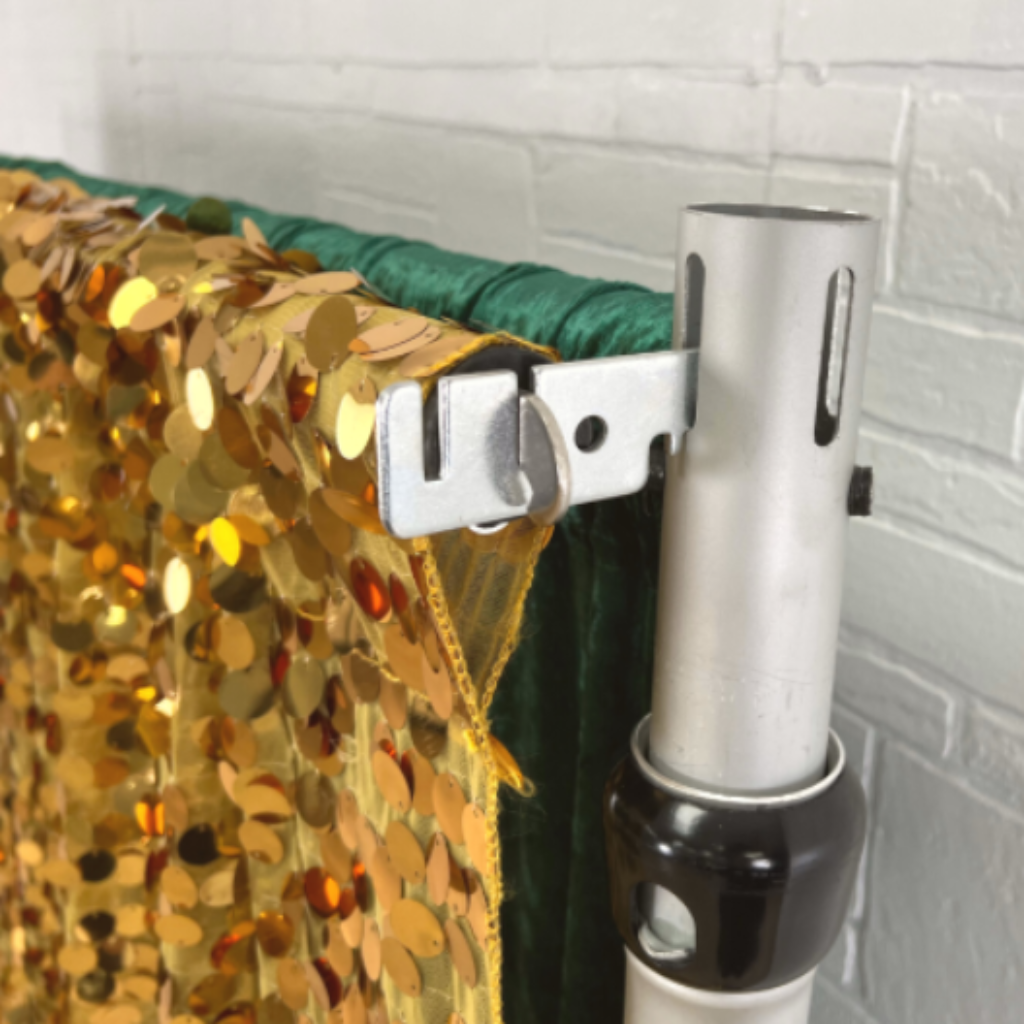 Valance Hanger 3" (2 pcs/set) on a crossbar setup with gold round sequin drape and velvet emerald green drape