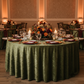 indoor autumn dinner with Velvet 132" Round Tablecloth - Dark Sage Green