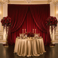 Velvet 14ft H x 52" W Drape/Backdrop Curtain Panel Apple Red with gold tablecloth, gold charger plates and glass goblets