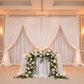 Velvet 16ft H x 52" W Drape/Backdrop Curtain Panel - White with a double crossbar setup at the back of white wedding sweetheart table