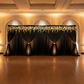 Velvet 18ft H x 52" W Drape/Backdrop Curtain Panel - Black with white premade floral runner on top and sash ties for wide shot angle of wedding reception