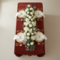 Velvet 90"x132" Rectangular Tablecloth Apple Red top view table setting with white floral table runner, gold charger plates, and white napkins