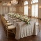 Velvet 90"x132" Rectangular Tablecloth Taupe formal dinner setting with floral and greenery table runner and gold chiavari chairs