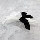 10 pc/pk Velvet Bow-Tie Napkin Ring Black on a white napkin