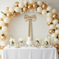 Velvet Giant Fabric Bow for Backdrop Champagne behind a dessert table
