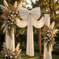 Velvet Giant Fabric Bow for Backdrop Ivory outdoor on a wooden arch with boho chic florals