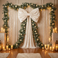 XL Velvet Giant Fabric Bow for Backdrop Ivory paired with glitz mesh drapes and florals with greenery