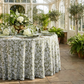 Vintage Lace Print Scuba Round Tablecloth Olive Green/White with olive green napkin, goblets and floral centerpieces