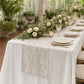 Vintage Lace Print Scuba Table Runner Champagne/White on a rectangular table with dinner plates and candelabras
