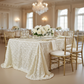 Wedding Rosette Satin 90"x156" rectangular Tablecloth - Ivory with gold trimmed charger plate | white dinner plate | gold chiavari chair | white napkin