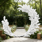 White Cherry Blossom Crescent Arch Backdrop outdoor setting with wood planks and greenery