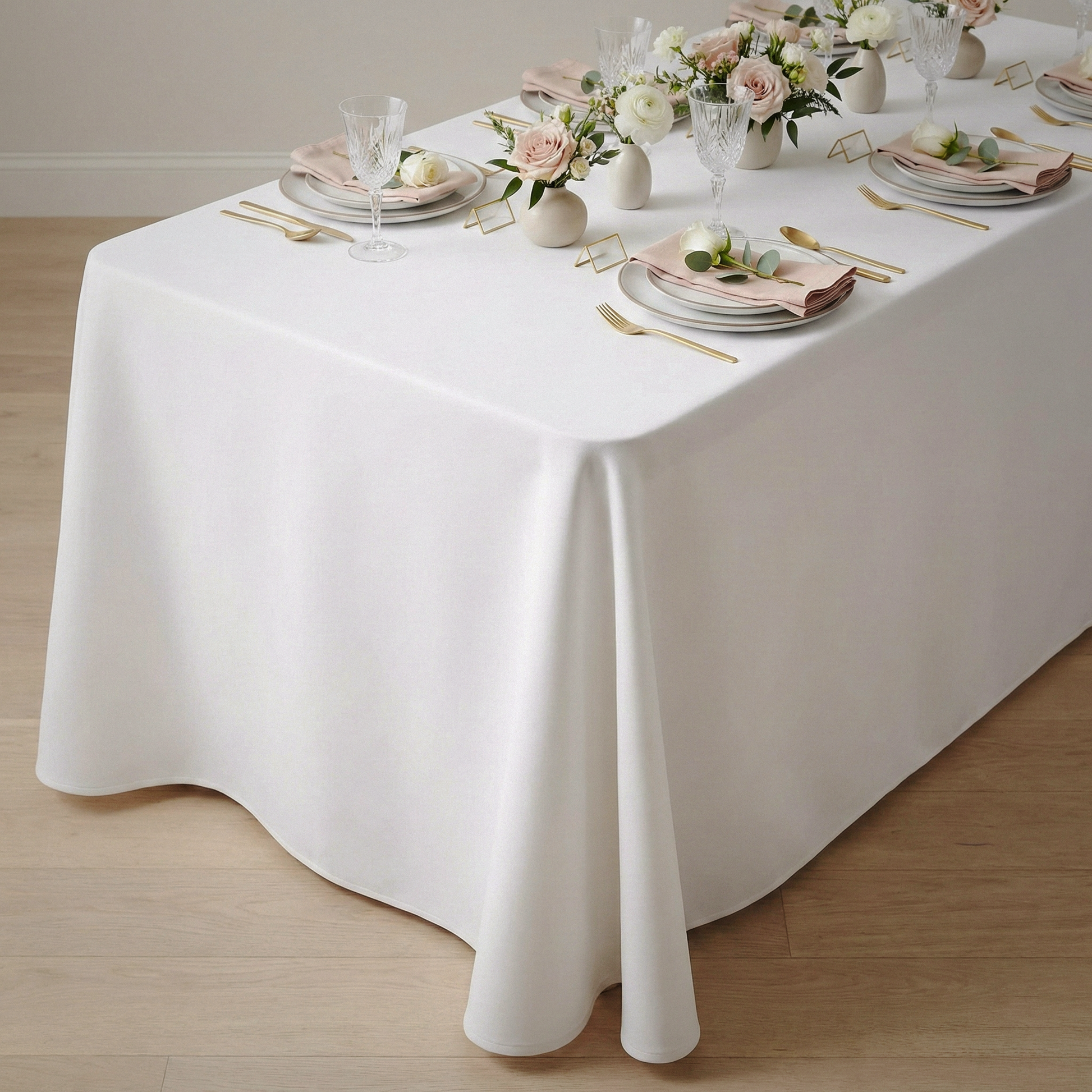 Scuba King 108"x156" Rectangular Tablecloth White table setting floral centerpieces, white dinnerware, and wine glasses
