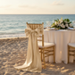 Wide Satin Chair Sash - Champagne for beach front reception with | gold chiavari chair | ivory tablecloth | wine goblets | gold trimmed charger plate