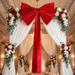 XL Velvet Giant Fabric Bow for Backdrop Apple Red with sheer white backdrop drapes and red and white florals