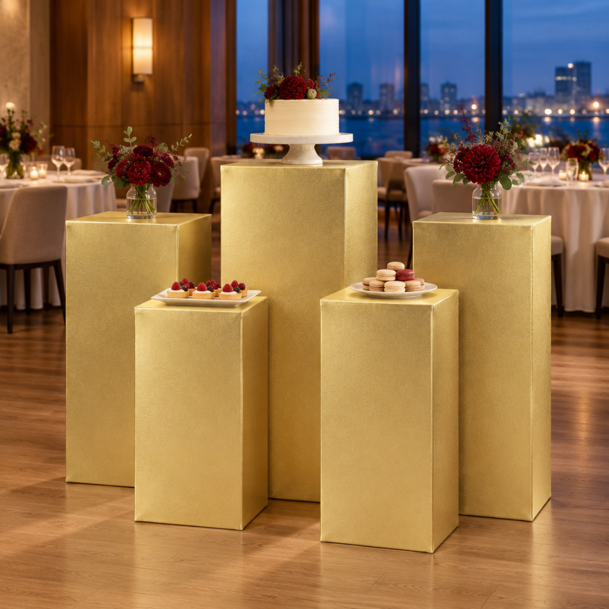 Anniversary dinner with metallic gold square pedestal covers