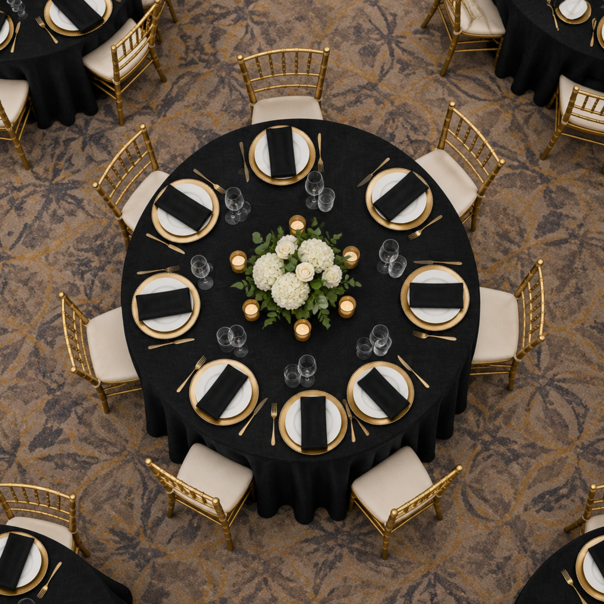 Overhead view of black panama tablecloth in a ballroom