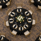 Overhead view of black panama tablecloth in a ballroom