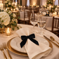 Candlelit reception with black velvet bow-tie napkin ring