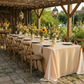 Rustic reception with the champagne premium satin wrinkle-resistant- rectangular tablecloth with wild flower centerpieces and barn style chairs