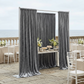 Charcoal velvet backdrop at a coastal patio reception