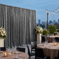 Charcoal velvet backdrop at an outdoor rooftop gala