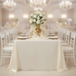 Economy Polyester Tablecloth 90"x156" Oblong Rectangular - Ivory with White Chiavari Chairs.