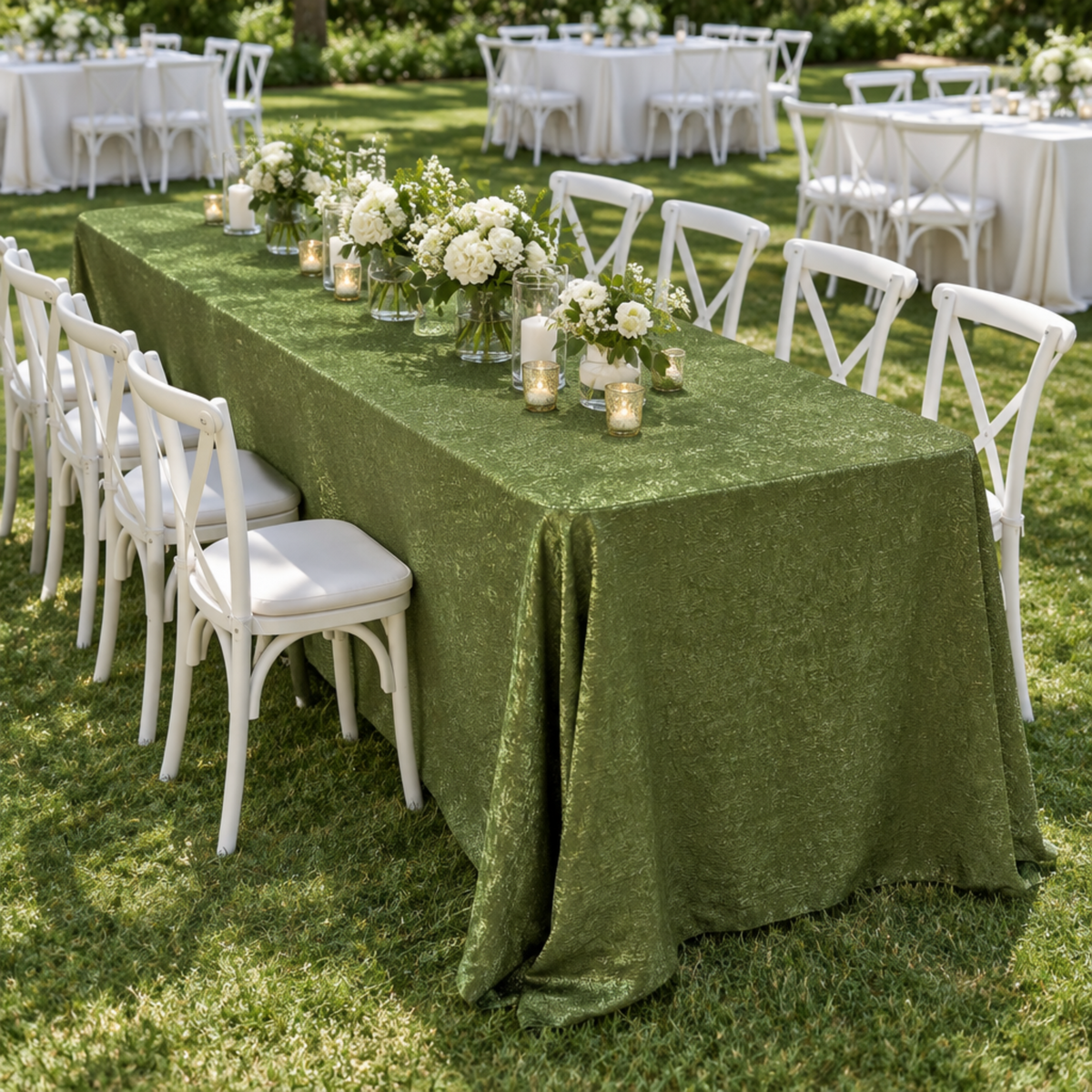 Elevated corner view of the Willow Green tablecloth on a lawn
