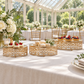 Three gold cake stands at a conservatory reception