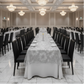 Hotel ballroom gala with silver chain lace table overlay