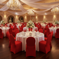 Indoor Ballroom Wedding Reception with Red Spandex Banquet Chair Cover