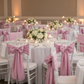 Indoor banquet with dusty rose pink chair sashes
