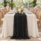 Straight-on event view of the black cheesecloth table runner