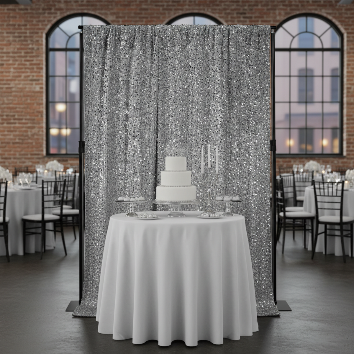 Indoor contemporary event venue with silver sequin velvet drape