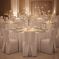 Indoor event with hanging glass globe tealight holders