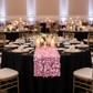 Indoor wedding reception with black tablecloth