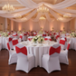 Indoor Wedding Reception with Red Ruffled Spandex Chair Band
