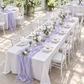 Lavender cheesecloth runner at a bright conservatory bridal shower