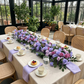 Lavender floral table decor at a conservatory bridal shower