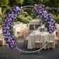 Lavender floral arch at a garden wedding reception