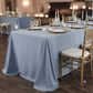 90"x132" Rectangular Oblong Premium Polyester Tablecloth - Dusty Blue with Chiavari Gold Chairs.