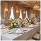 Economy Polyester Napkin 20"x20" - White in Indoor Wedding Reception with Tables and Chiavari Gold Chairs.