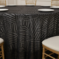 Geometric Glitz Art Deco Sequin Tablecloth 132" Round - Black with Chiavari Gold Chairs.