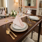 Lifestyle indoor with blush rose gold lamour satin napkin 