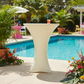 Spandex Cocktail Table Cover 30" Round - Ivory in Outdoor Pool Reception.