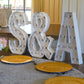 Large 4ft Tall LED Marquee Letter - A indoor setting with tables and plates.
